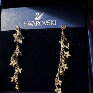 Swarovski clear crystal star earrings in silver tone.